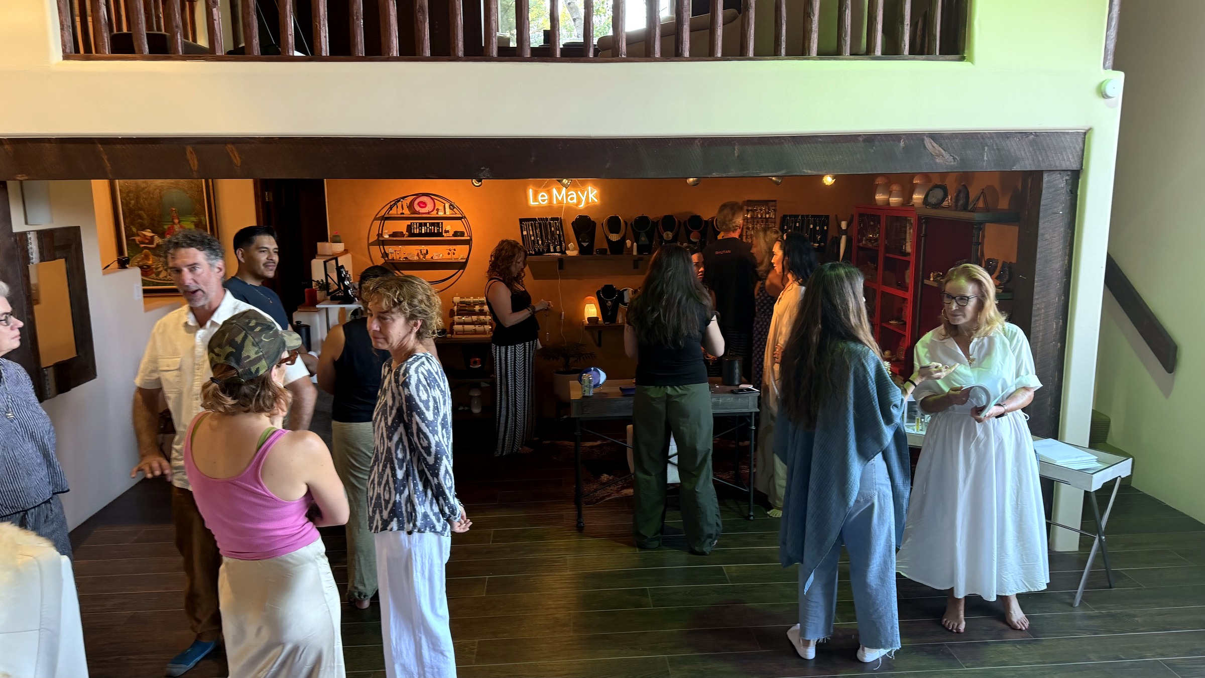 Guests talking and browsing the LeMayk boutique during the Echo Salon