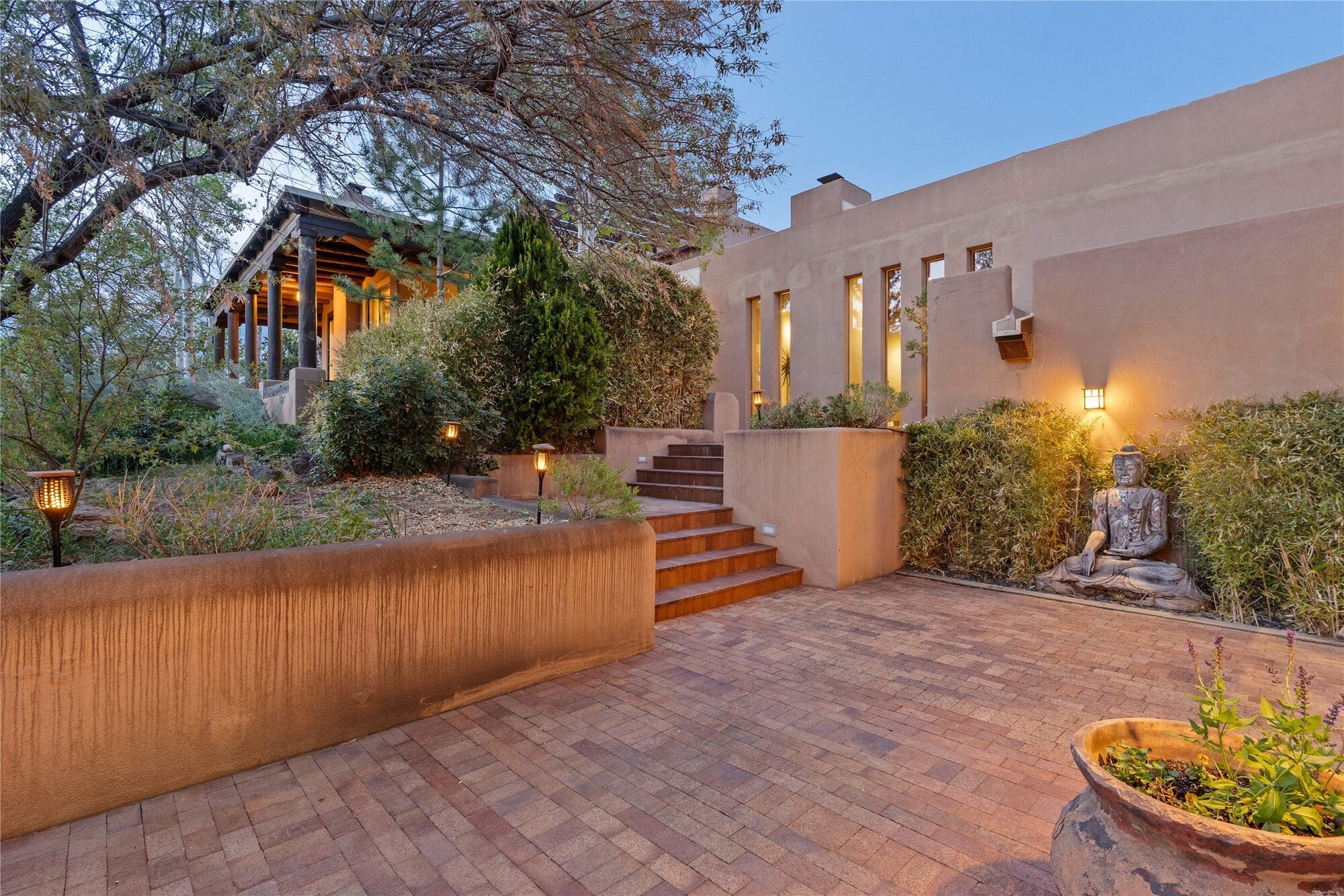 The ranch entrance and courtyard glowing at dusk