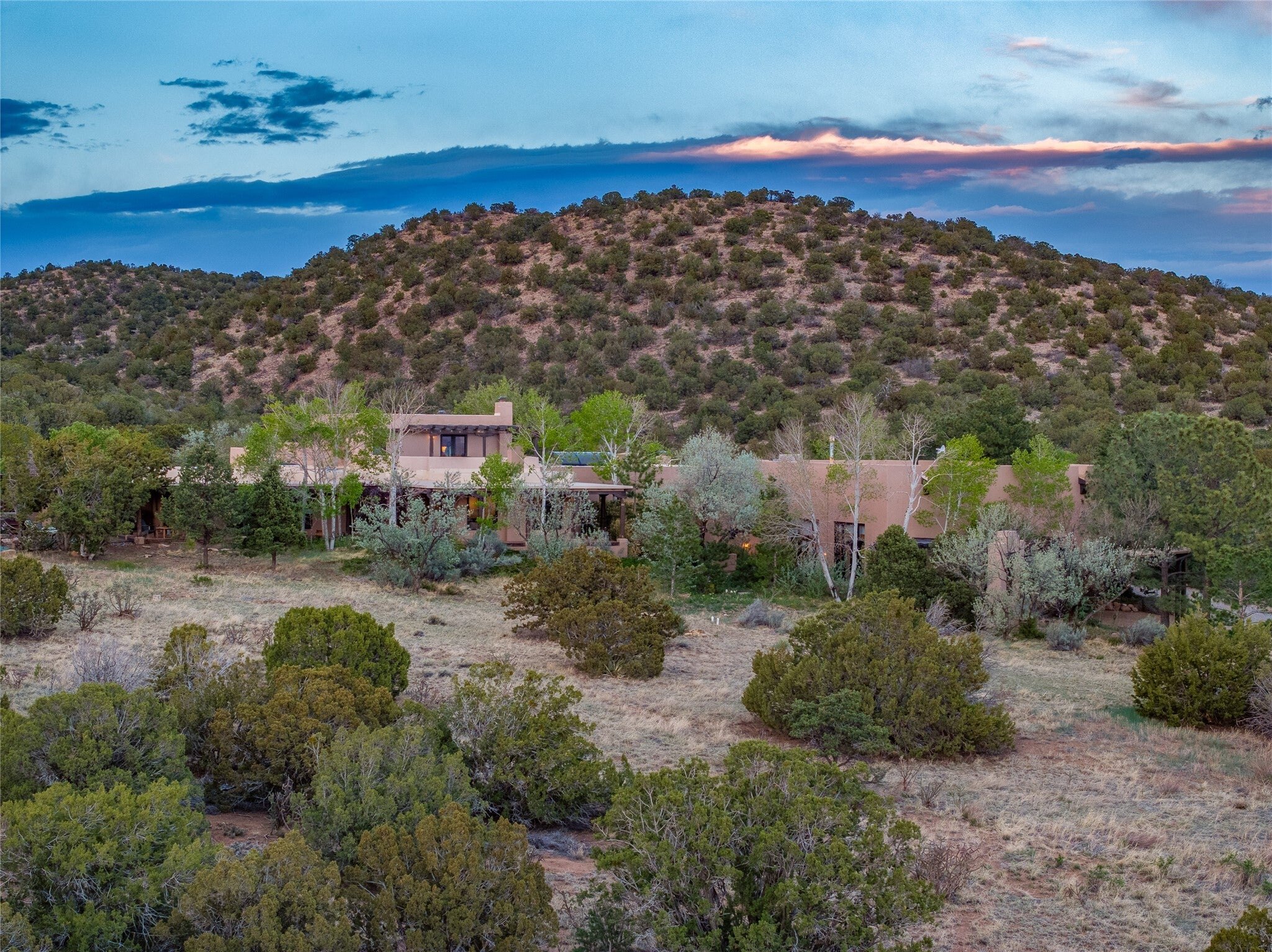 The ranch home and its high-desert surroundings seen from above